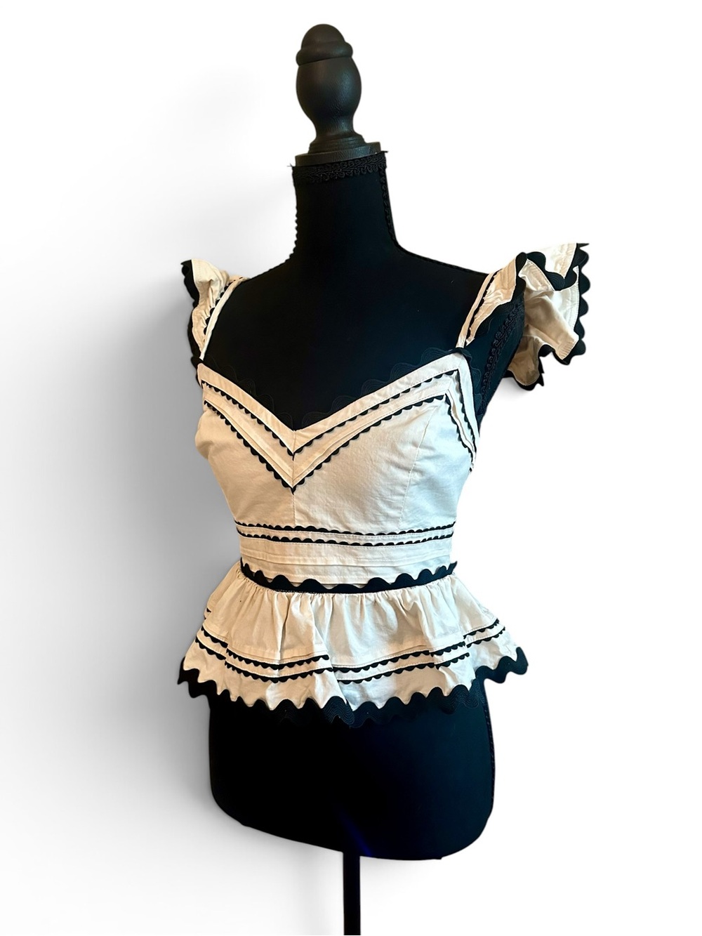 Ivory Ruffle Peplum Camisole with Black Trim